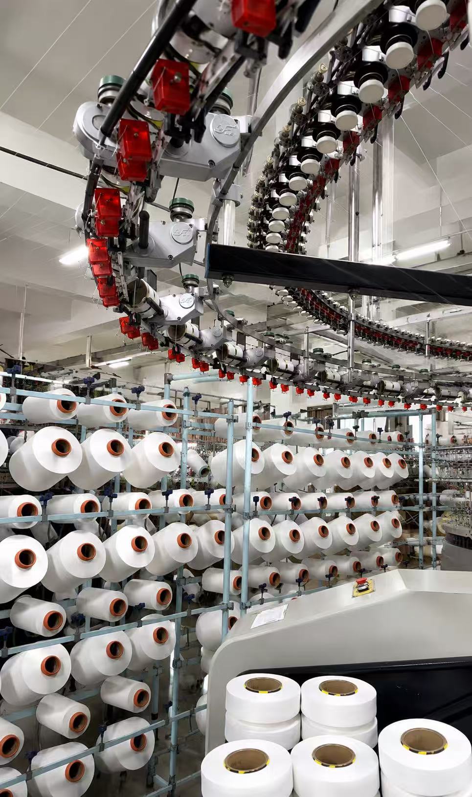 Yarn creel and overhead feeding system